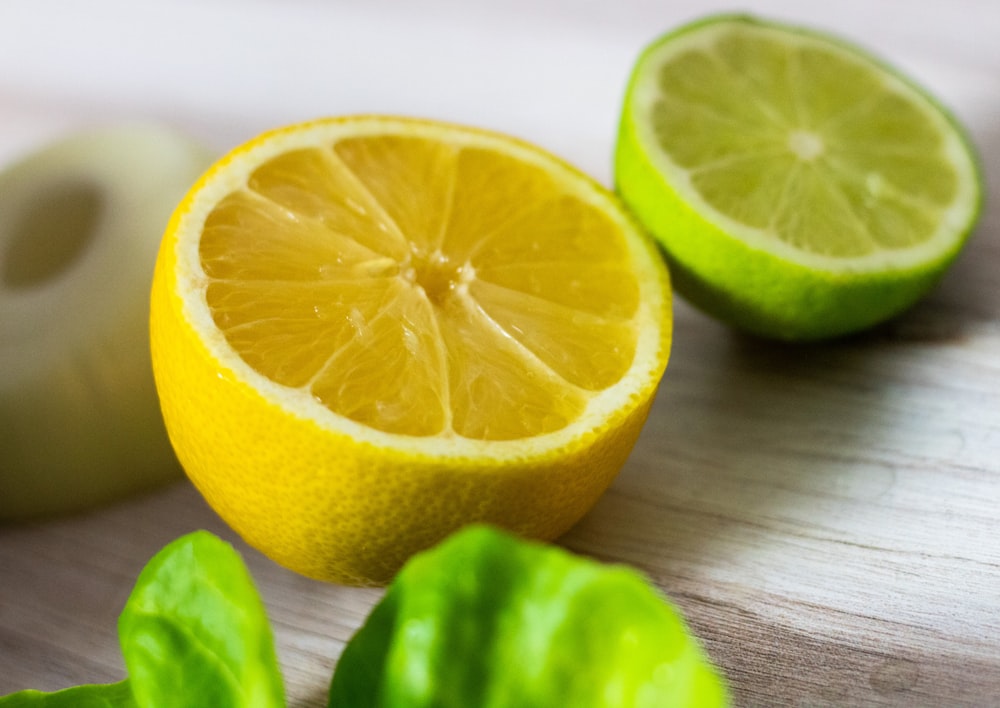 a cut up lemon sitting on top of a wooden table