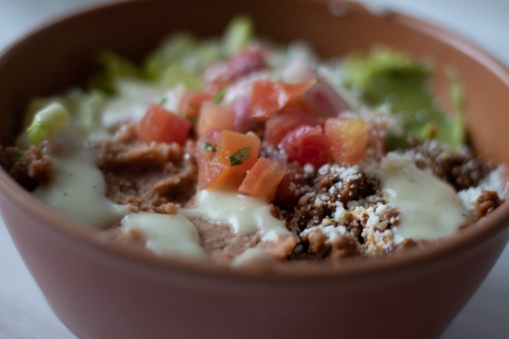 a close up of a bowl of food on a table