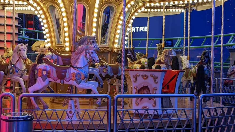 a merry go round at a carnival with people on it