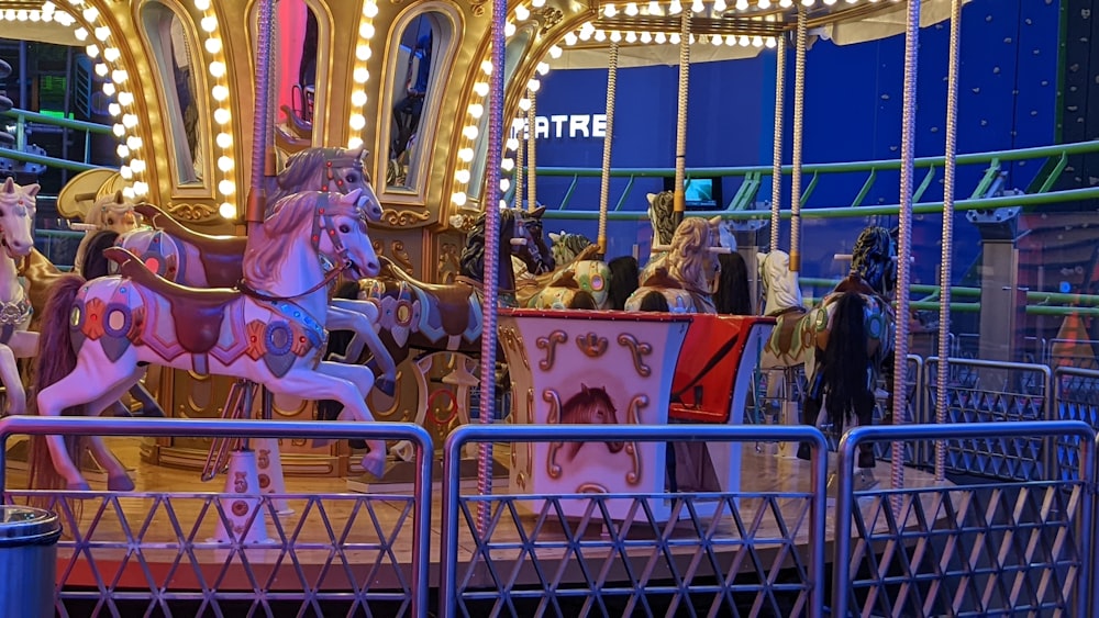 a merry go round at night with people on it