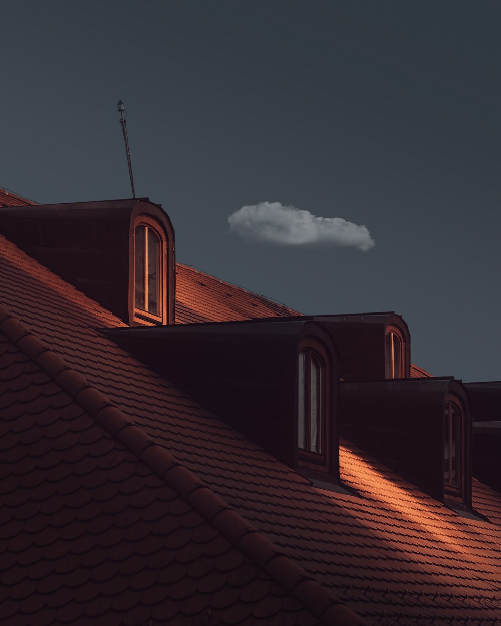 a view of the roof of a house at night