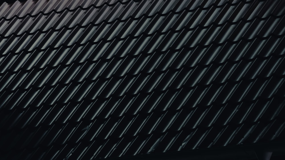 a close up of a building with a black roof