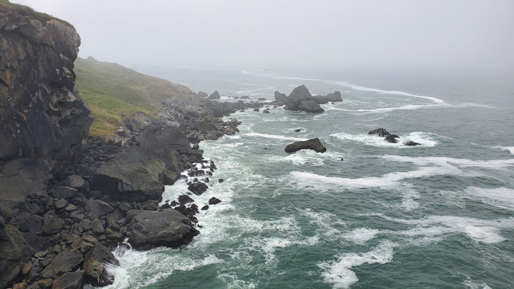 a view of the ocean from the top of a cliff