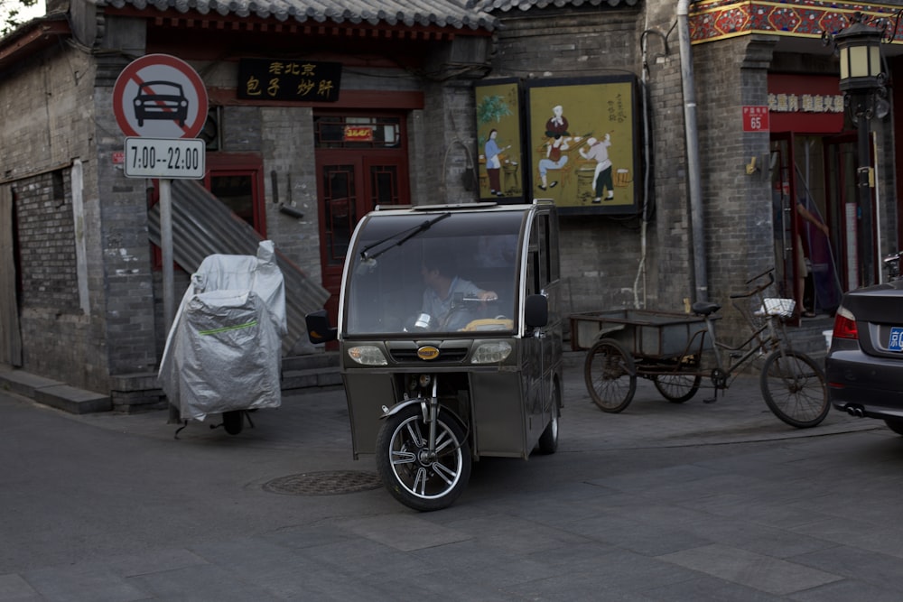 a baby stroller parked on the side of a street