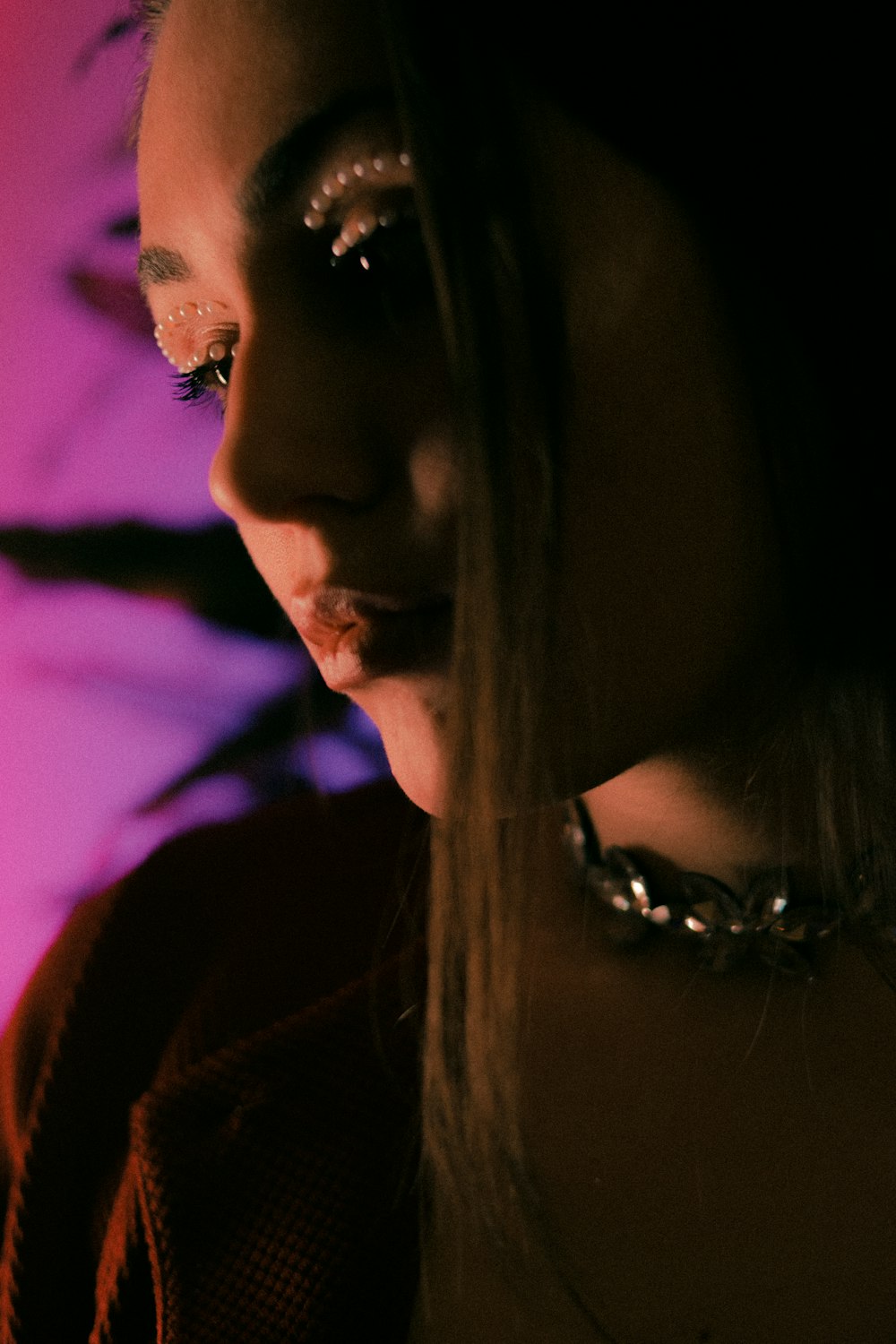 a close up of a person wearing a choker