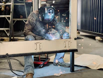 a welder working on a piece of metal