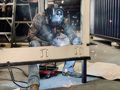 a welder working on a piece of metal