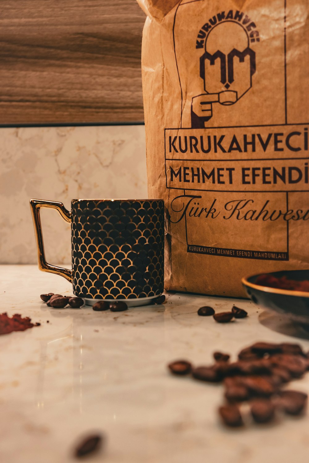 a bag of coffee sitting next to a coffee mug