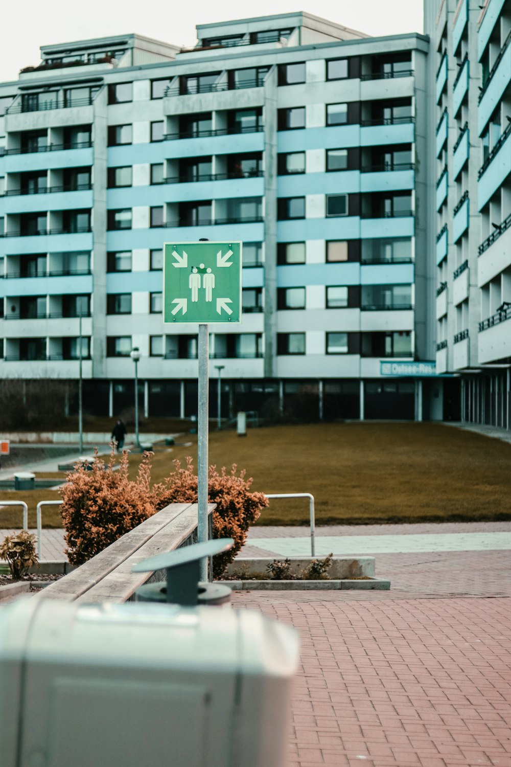 a green street sign sitting on the side of a road