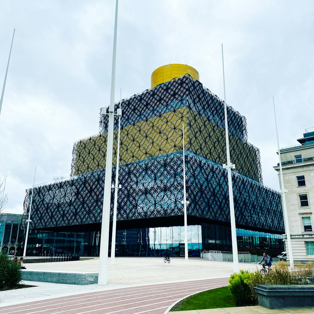 a large building with a yellow and blue design on it