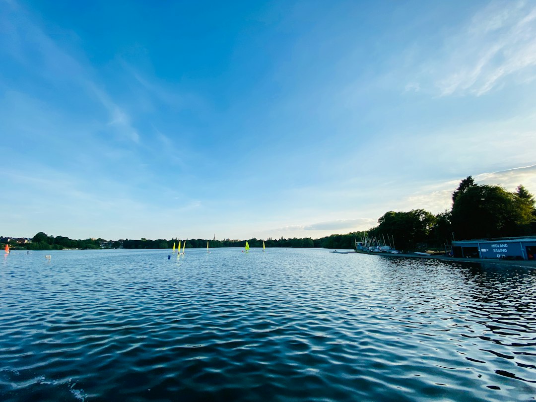 a body of water with boats floating on it,