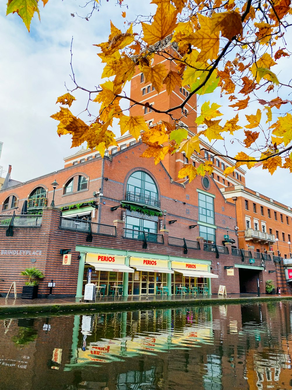 a large brick building sitting next to a body of water