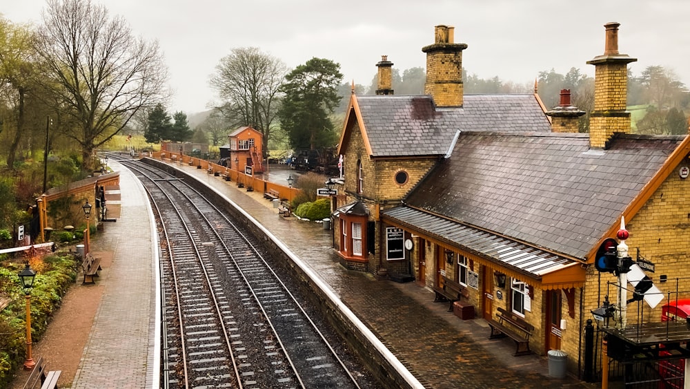 a train station with a train on the tracks