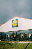Entrance of a local supermarket partner with visible discount signs for union members.