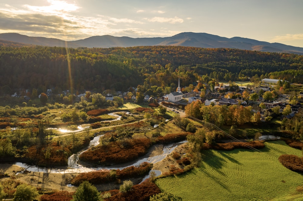 an aerial view of a small town surrounded by mountains