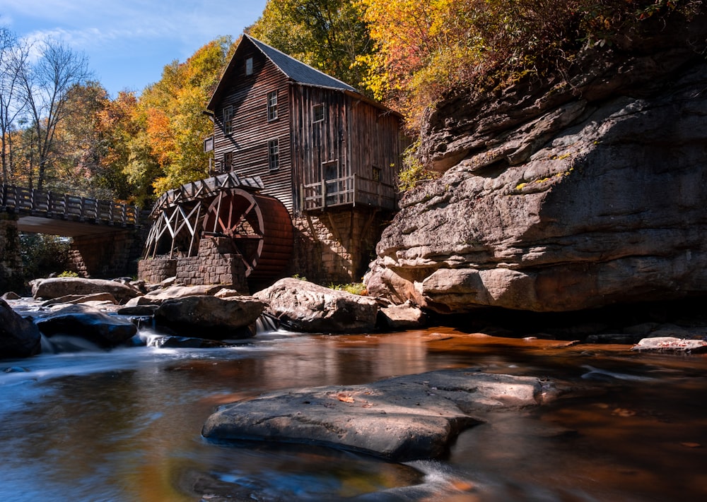 a water mill in the middle of a river