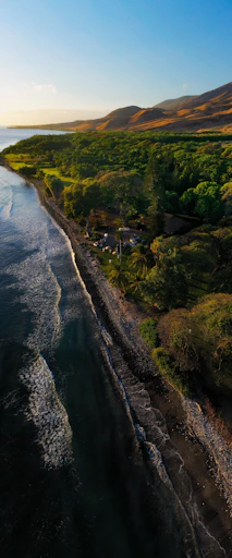 an aerial view of a body of water near a beach