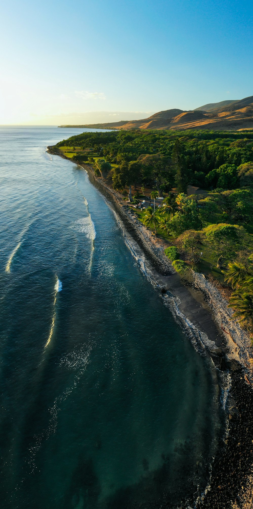 an aerial view of a body of water near a beach