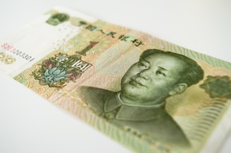 Vintage Asian banknote featuring traditional artwork.