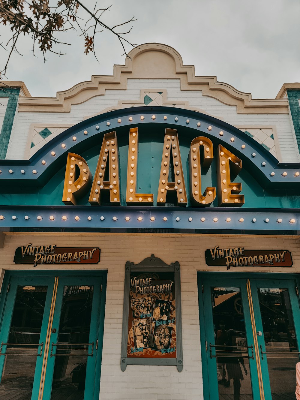 a sign that says palace on the front of a building