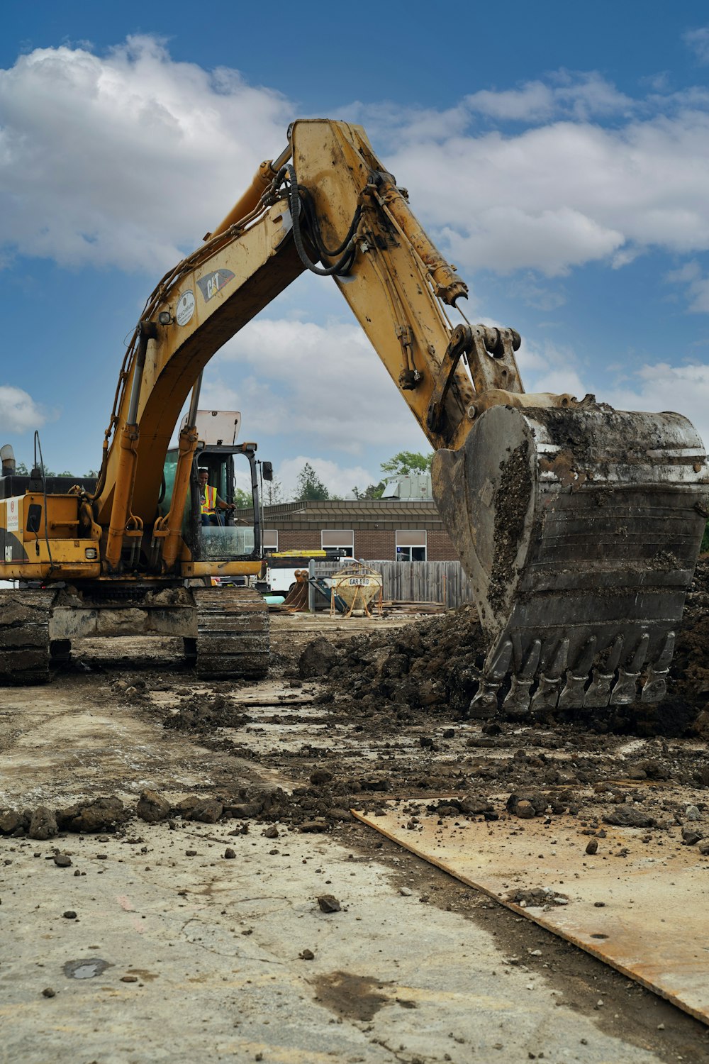 a bulldozer digging through a construction site