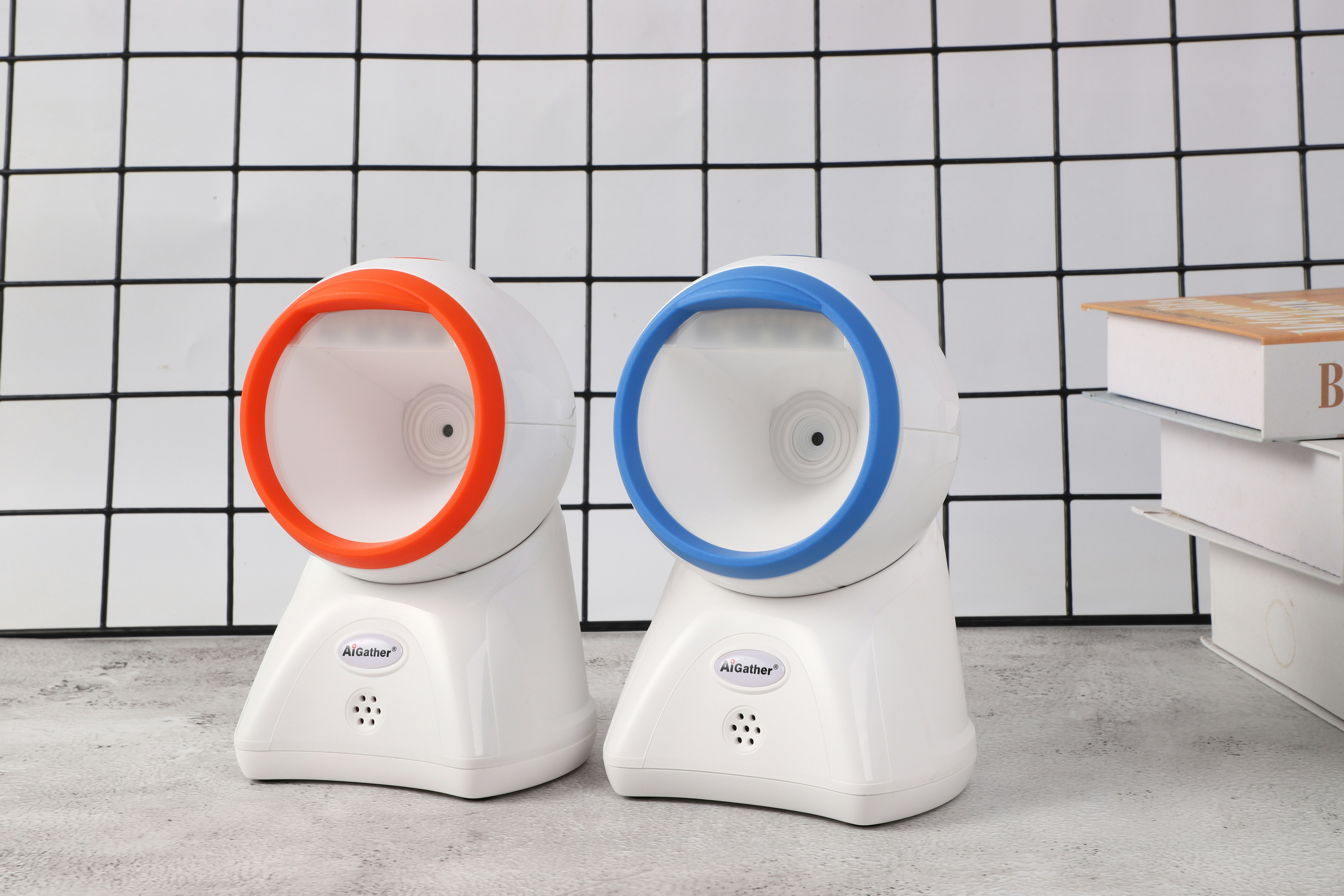 a couple of white speakers sitting on top of a table