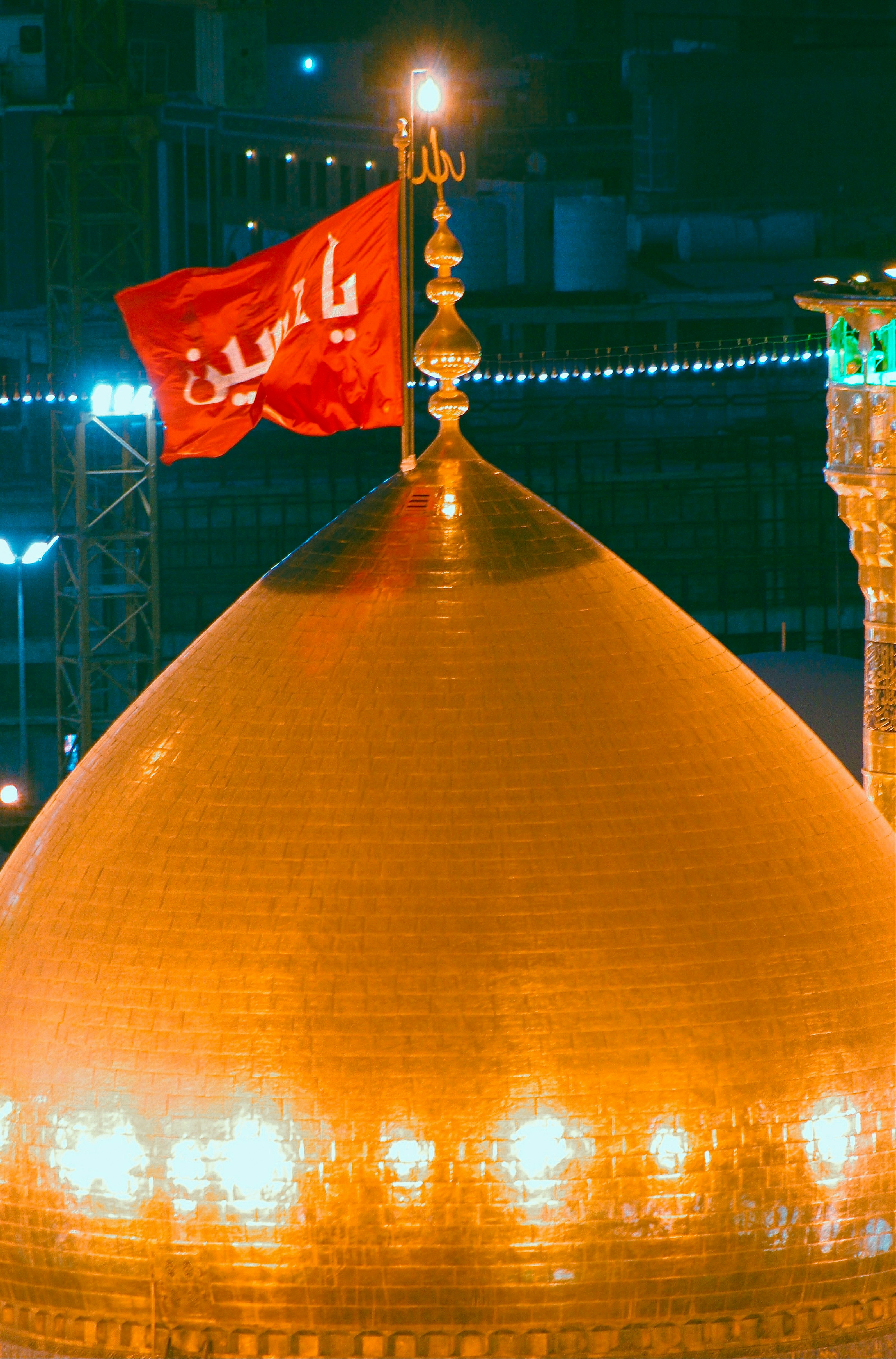 a large dome with a flag on top of it