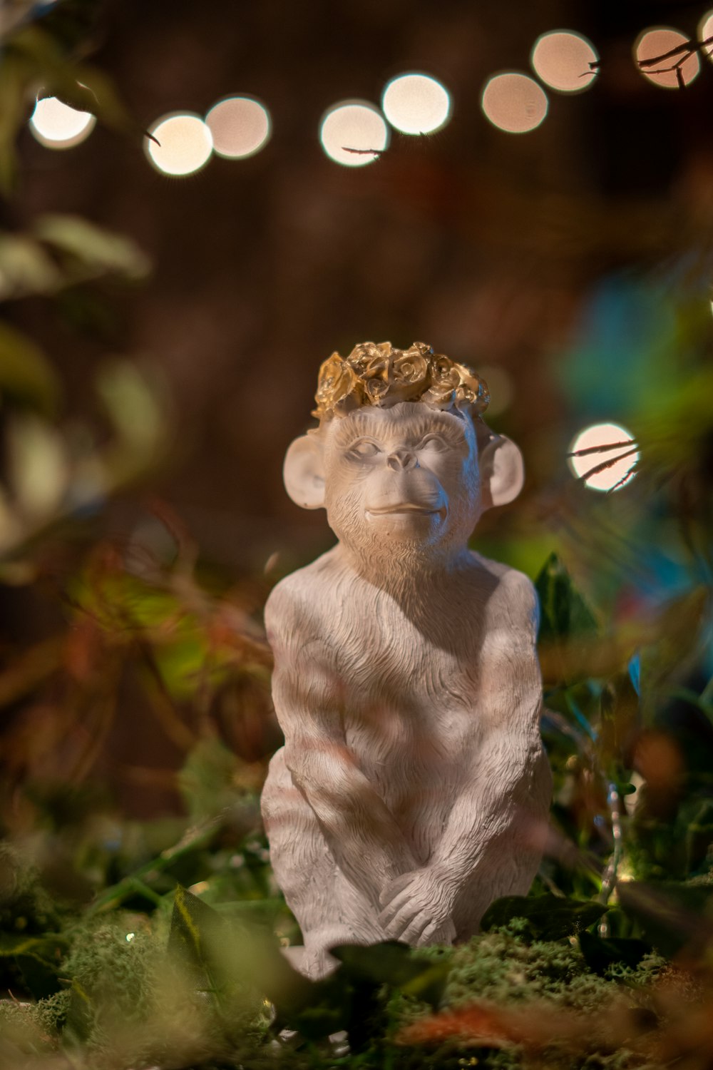 a statue of a monkey with a crown on his head