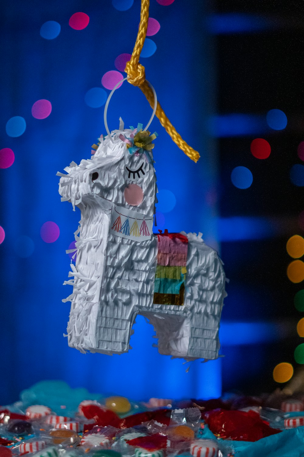 a white horse ornament hanging from a string