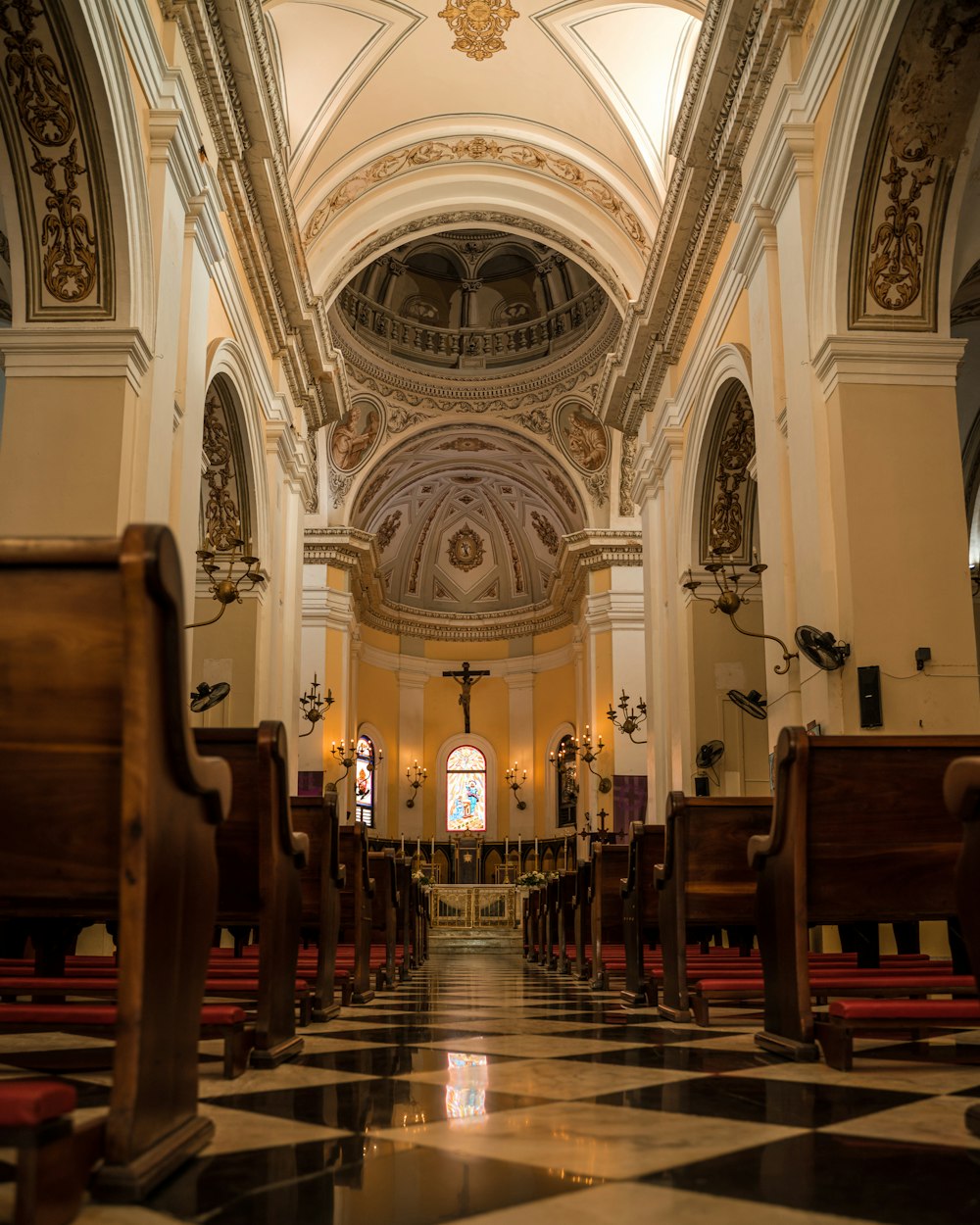 the interior of a church with a checkered floor