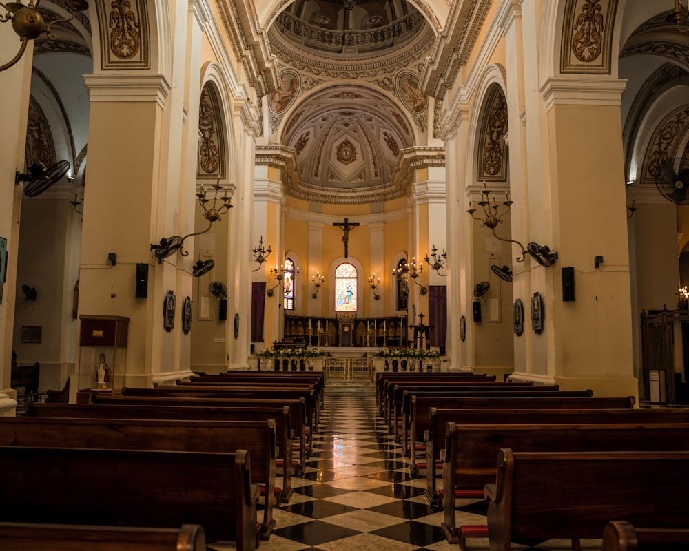 the inside of a church with a checkered floor