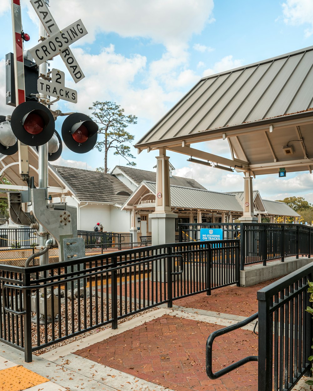 a railroad crossing signal at a train station