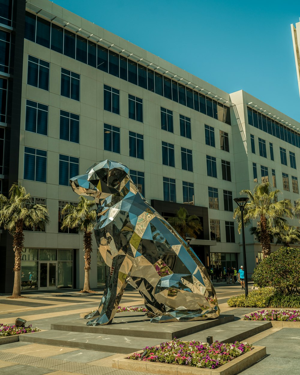 a sculpture of a dog in front of a building
