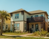 a two story house with a balcony and balconies