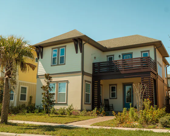 Two-story home with a balcony representing whole-home surge protection