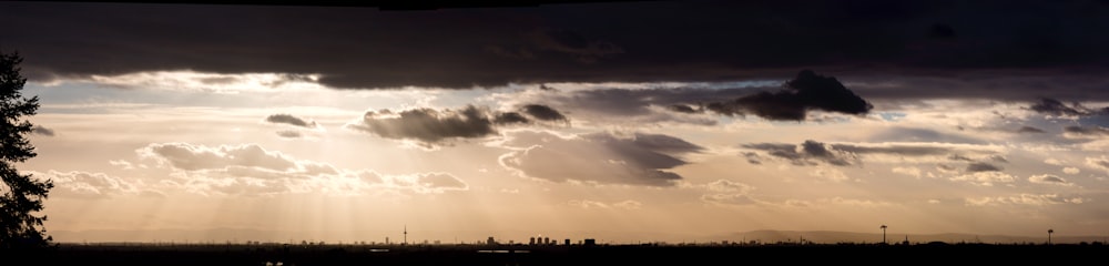 the sun is shining through the clouds in the sky