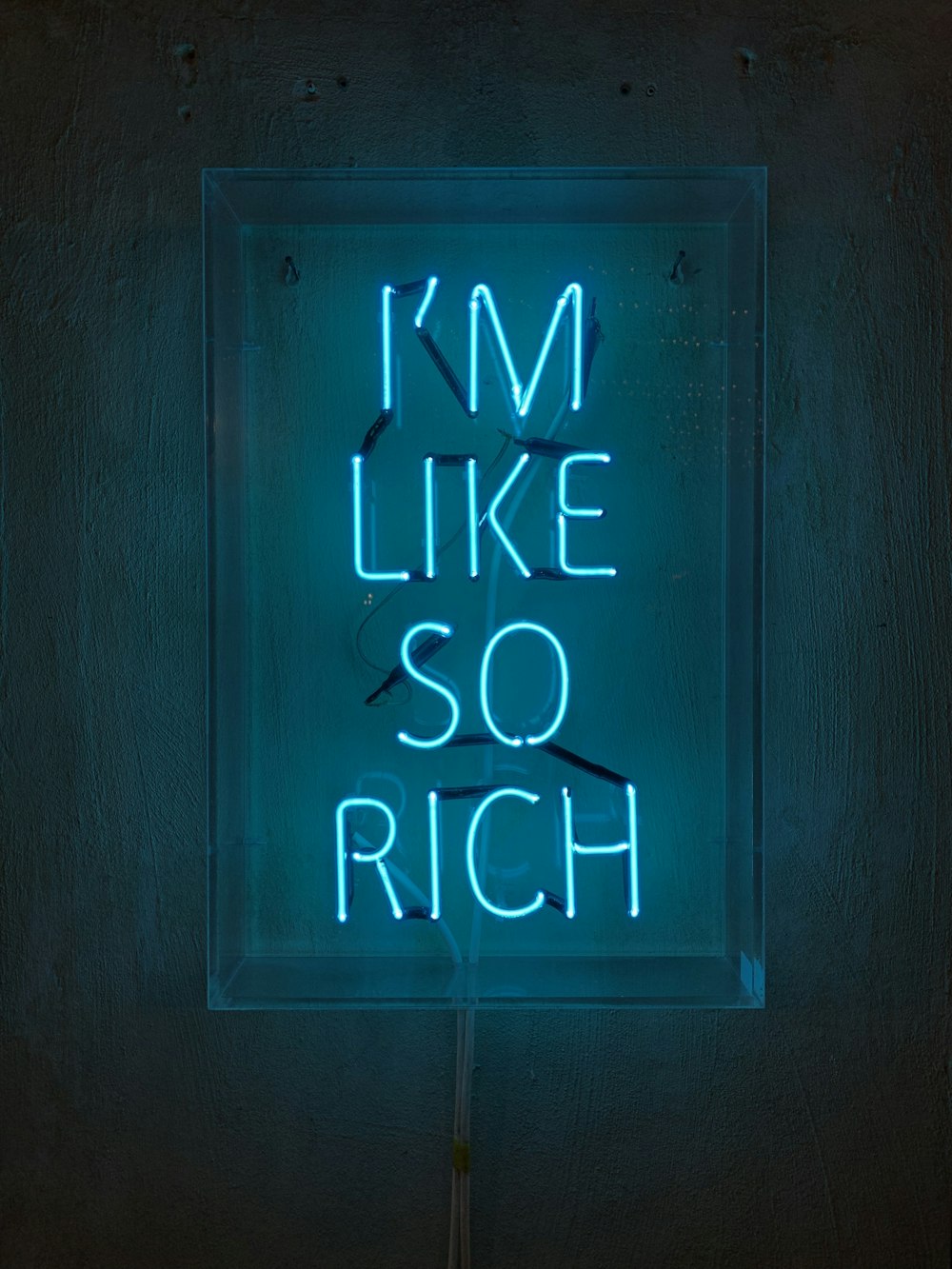 a neon sign that says i'm like so rich