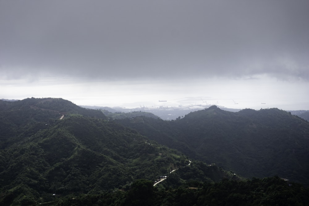 a view of a mountain range with a cloudy sky