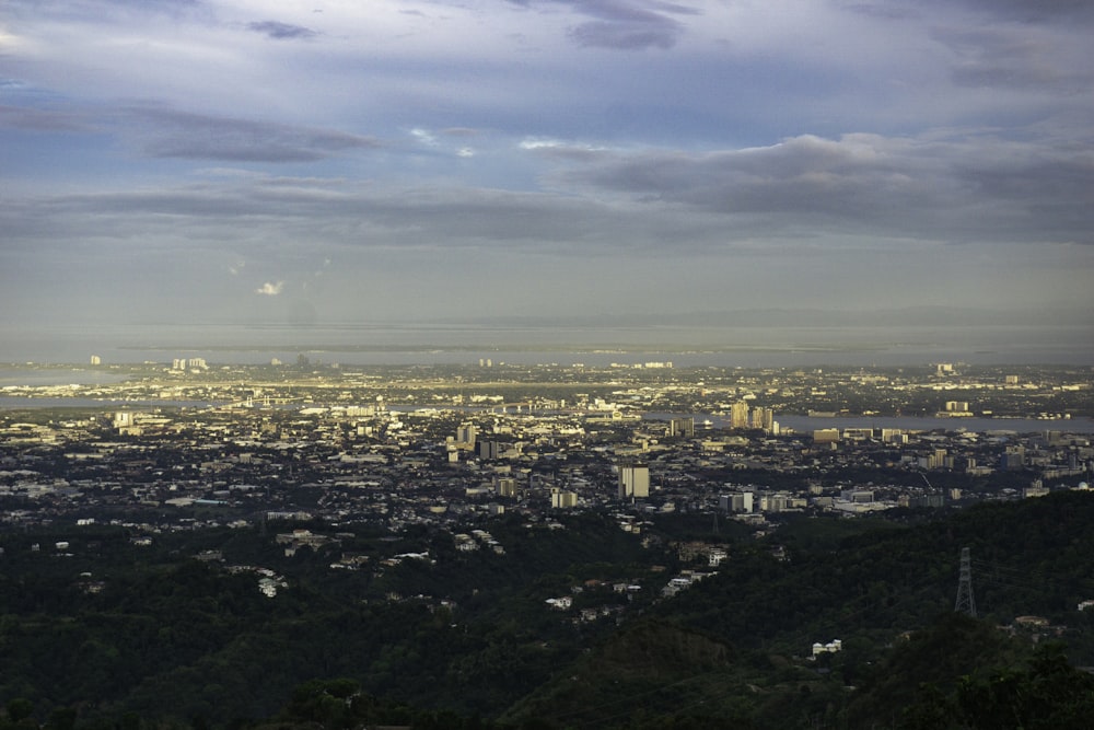 a view of a city from the top of a hill