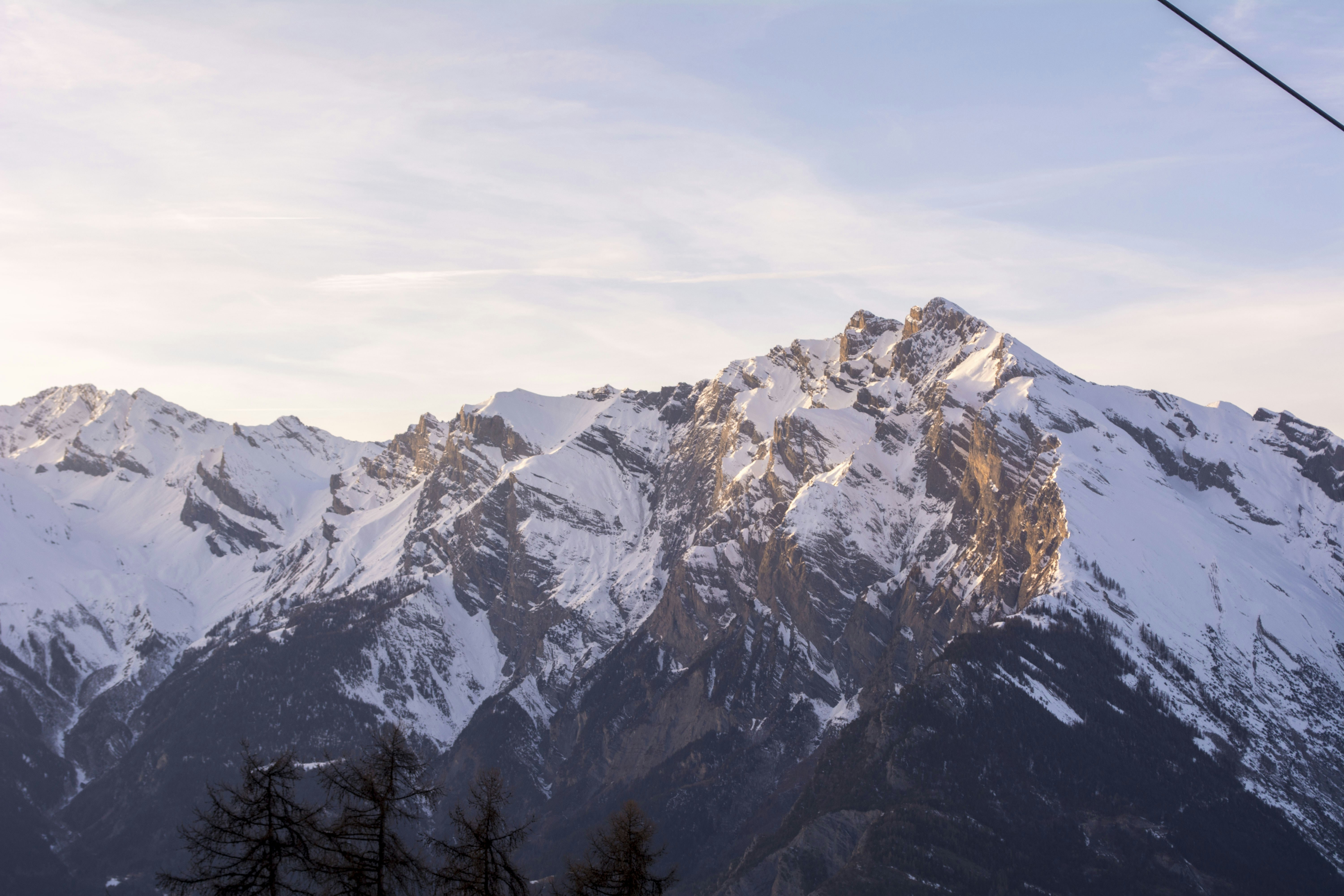 a view of a mountain range from a ski lift