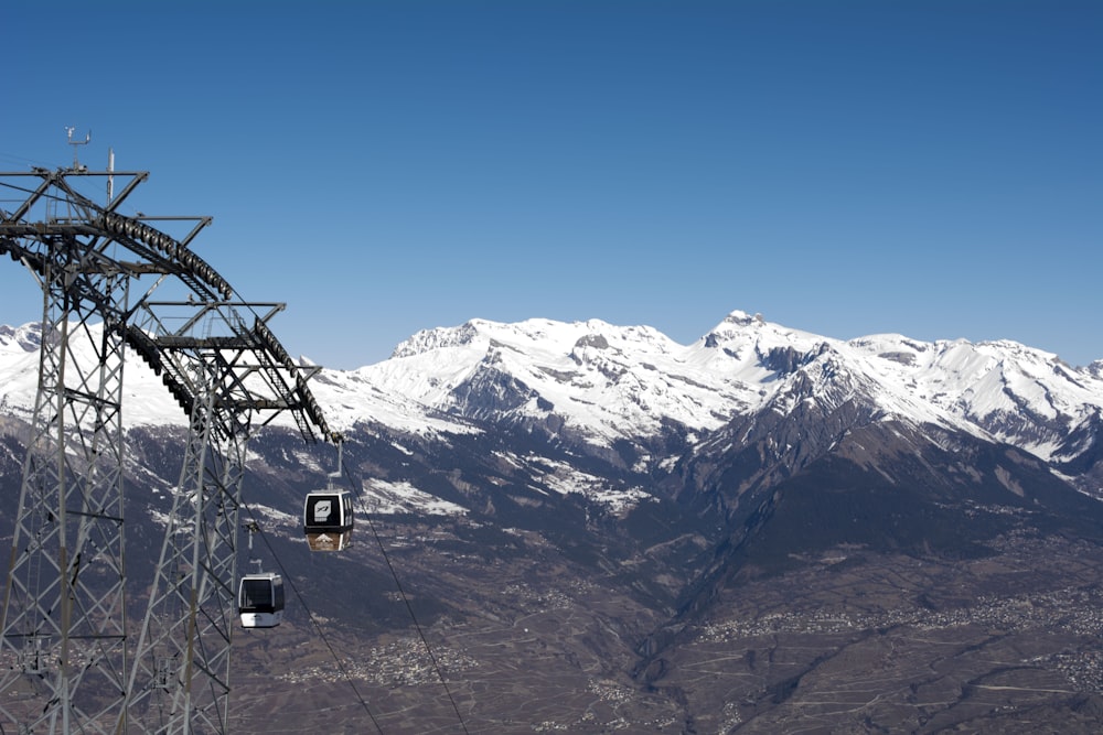 a ski lift going up the side of a mountain