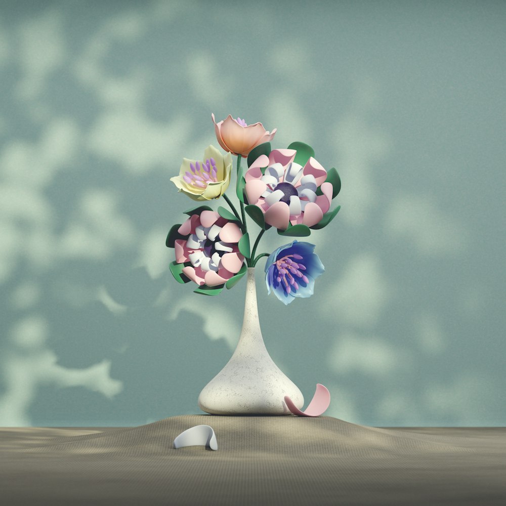 a vase filled with flowers sitting on top of a table