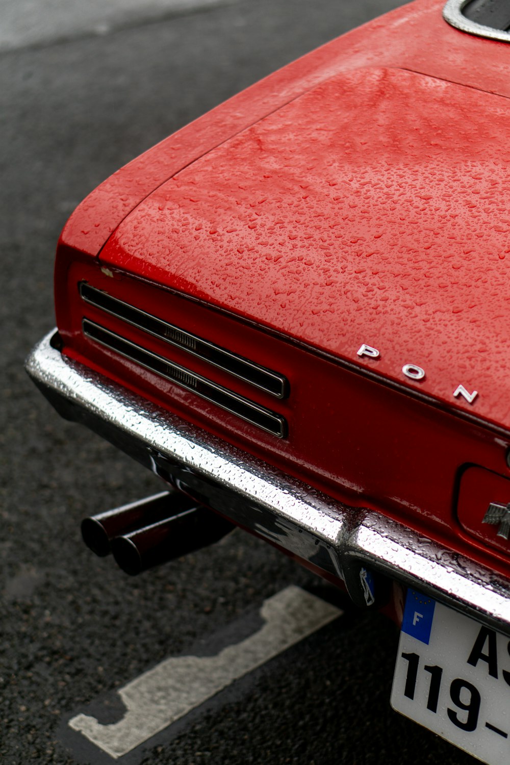 a red car parked in a parking lot