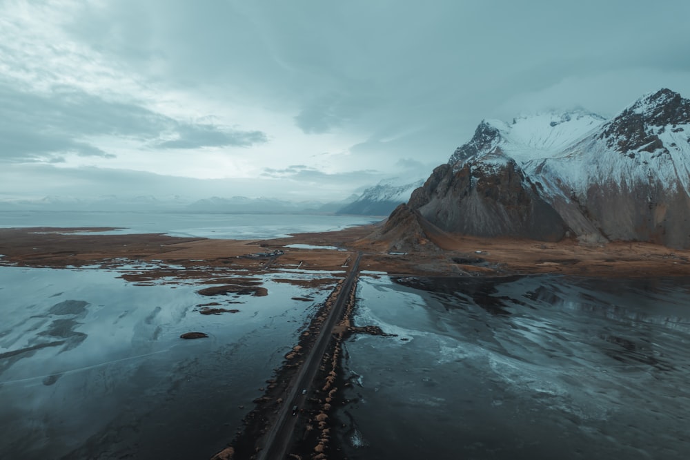 an aerial view of a mountain and a river