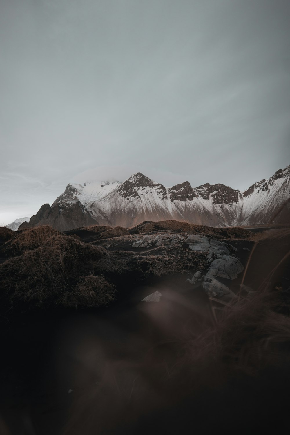 a mountain range with snow on top of it