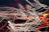 Abstract visualization of connecting neural synapses with light trails.