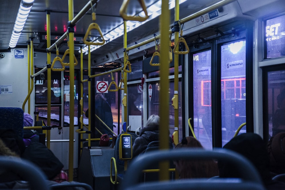 a group of people sitting on a bus