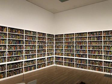 Volunteers sorting donated books in a bright, eco-friendly warehouse.
