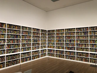 Volunteers sorting donated books in a bright, eco-friendly warehouse.