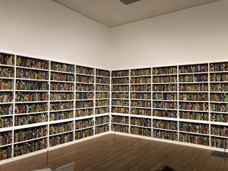 Photo of Inkwell Press team packaging books in a bright, organized warehouse.